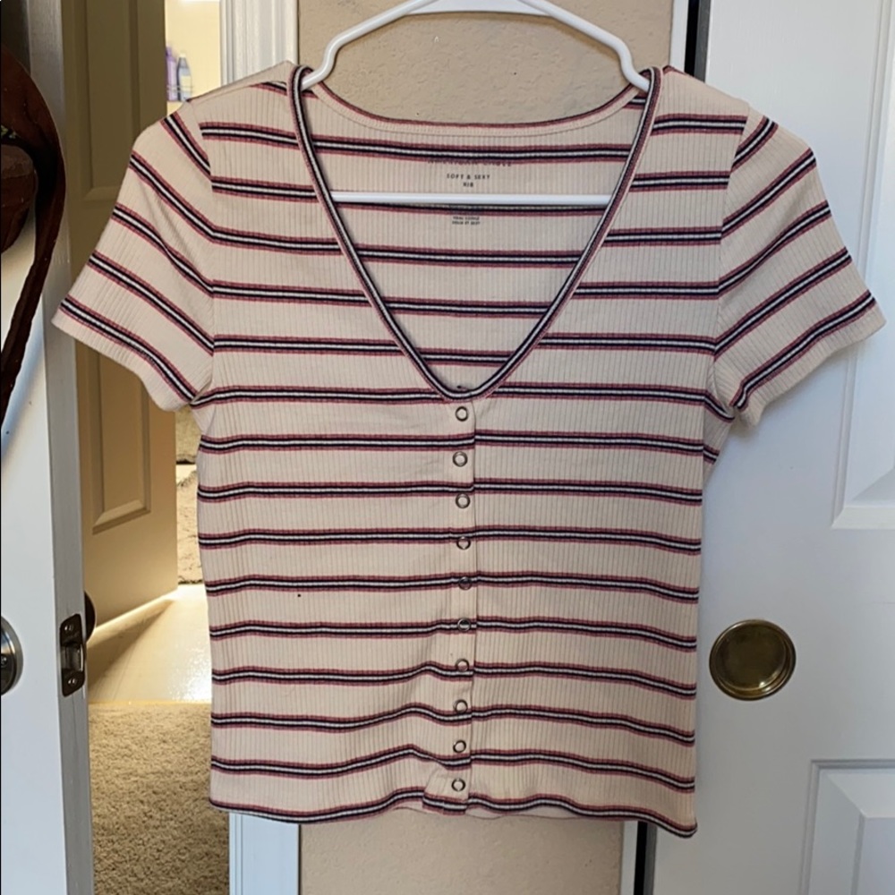 Shirt. Button up, stripped. Beige colored.